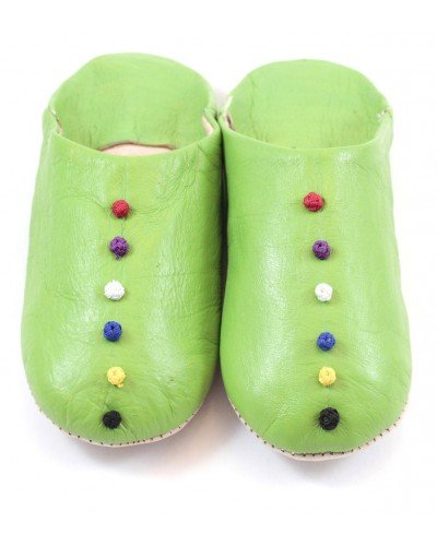 Pom-pom slippers in green leather