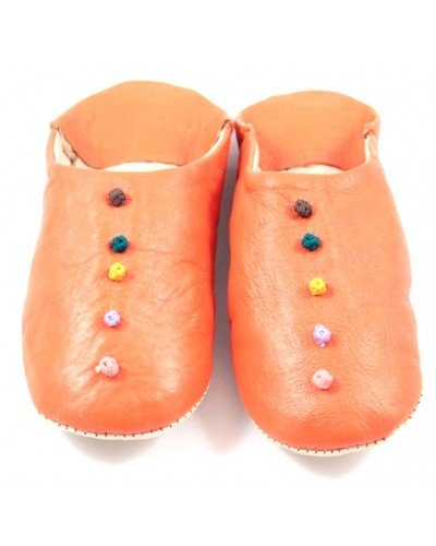 Pom-pom slippers in orange leather